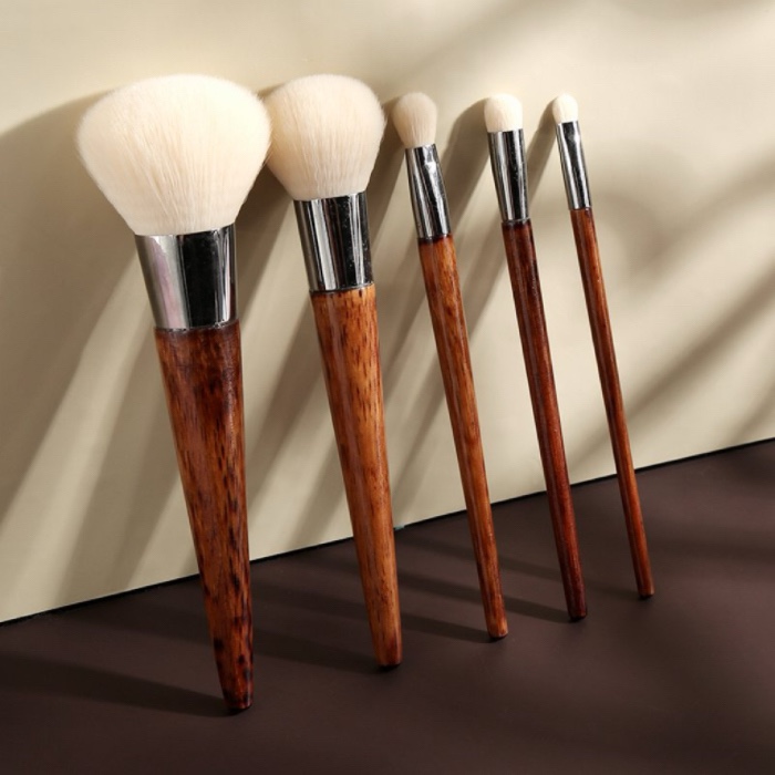 Makeup brush set with wooden handles and white bristles